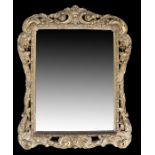 19th Century Italian partial gilt wall mirror, the scroll, the rectangular mirror plate within the