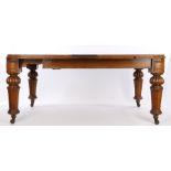 Victorian oak extending dining table, of large proportions, the rectangular top with rounded corners