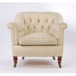 Howard & Sons button back low armchair, the sweeping button back and arms above a feather cushion