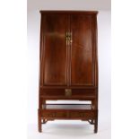 Chinese chestnut tapered cabinet on stand, Qing Dynasty, the moulded cornice above the pair of