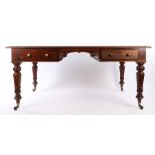 Victorian mahogany library table, of large proportions, the rectangular top with rounded ends