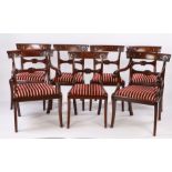 Set of seven late Regency mahogany dining chairs, the arched top rails with carved stylised tulips