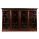 19th Century mahogany bookcase cabinet, the rectangular top with a gadrooned twist edge above four