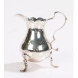 George II silver milk jug, London 1754, makers mark rubbed, with acanthus leaf capped double