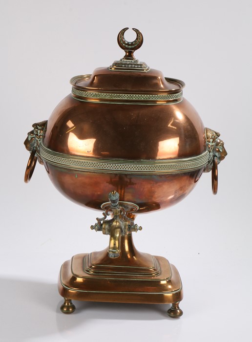 19th Century copper samovar, the lid with a crescent moon above a bulbous body flanked by lion