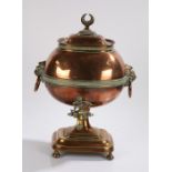 19th Century copper samovar, the lid with a crescent moon above a bulbous body flanked by lion