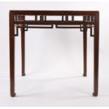 Chinese square table, with a plank top above openwork spandrels forming lattice work above the