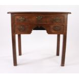 George III mahogany lowboy, the rectangular top with re-entrant corners above three drawers to the