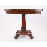 William IV rosewood games table, the folding rectangular top above an angled column with carved