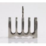 George VI silver toast rack, Sheffield 1937, maker George Unite, with pierced handle above four
