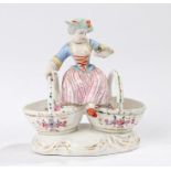 Meissen porcelain sweet meat, with a lady seated about the dual baskets decorated with flowers,