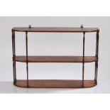 An elegant George III set of mahogany hanging shelves, with three rectangular shelves with rounded