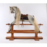 Fine F.H. Ayres rocking horse, circa 1915, large size, dapple grey with leather saddle, horse hair