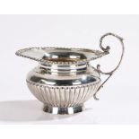 Edward VII silver cream jug, London 1903, maker William Hutton & Sons Ltd, with acanthus leaf capped