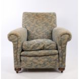 Heal & Son Ltd, a 1920's armchair, with a pad back above the scroll arms and seal, Heal & Son Ltd