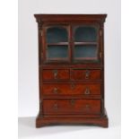 George III miniature mahogany cabinet, the plinth cornice above a pair of glazed doors, the lower