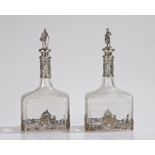 Pair of continental silver mounted bottles, the figural finials in the form of a lady and