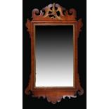 George III mahogany mirror, the rectangular mirror plate surmounted by a hoho bird and fret