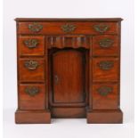 George III mahogany kneehole desk, the rectangular top above a long frieze drawer above size