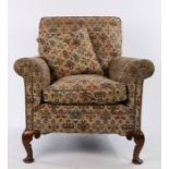 1920's Walnut and upholstered armchair, in the Howard & Sons style, with a low back and deep seat