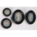 Set of four miniature Jasper porcelain plaques, two oval with maidens and two circular with