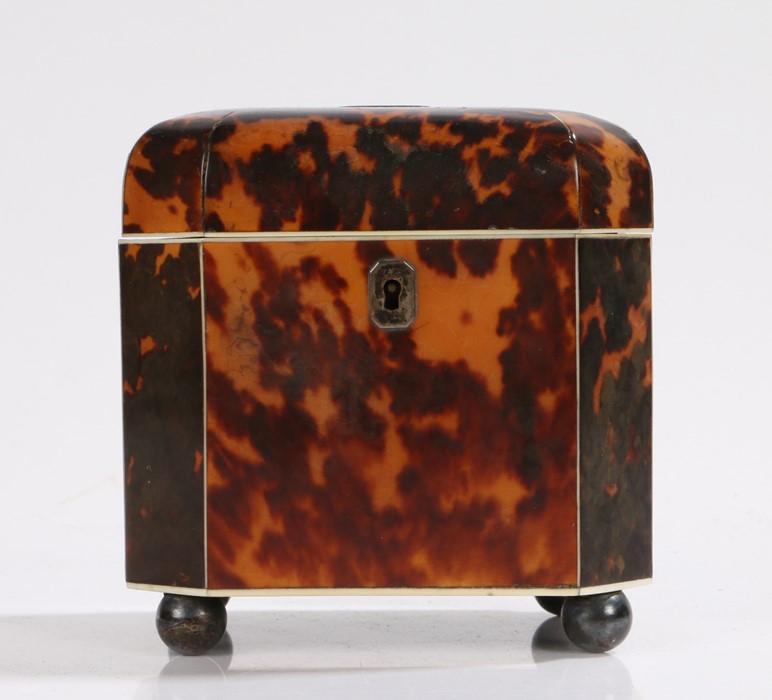 Regency period tortoiseshell tea caddy, of shaped octagonal form with ivory stringing and four