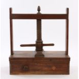 Victorian mahogany book press, with a central turned screw mechanism above a single drawer, 63cm