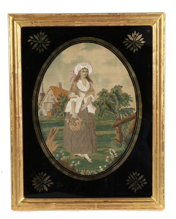 Early 19th Century silk work with a lady gardener, housed within the gilt and black glass frame,