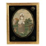 Early 19th Century silk work with a lady gardener, housed within the gilt and black glass frame,