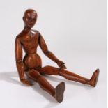 19th Century Artist Lay Figure, the carved head above the articulated jointed body, 41cm high