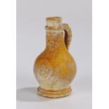 Unusual 19th Century miniature Bellarmine jug, with a mask and shield to the body, 7cm high