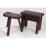 Two 19th Century milking stools, the first with three legs and an angled top, 32cm high, the