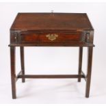 George III oak desk, the sloping fall enclosing pigeon holes and small drawers above a frieze drawer