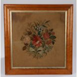 19th Century embroidery, with a central bouquet of flowers housed within a maple frame, 55cm x