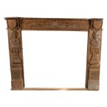 Mid to late 19th Century oak Elizabethan style fireplace, English, circa 1850 – 1880. The fire