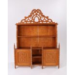 Set of early 20th Century pine hanging shelves, the fret arched pediment above shelves and a pair of