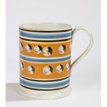 19th Century pearlware mocha mug, with bands of pale blue and orange and a roundel design to the