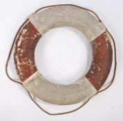 An early 20th Century life ring, in white and red