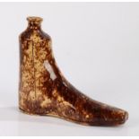 Victorian pottery treacle glaze novelty boot warmer, in the form of a boot with button holes to