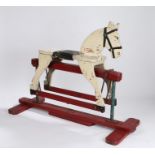 Mid 20th Century Folk Art rocking horse, the white painted horse above a red frame, 92cm long