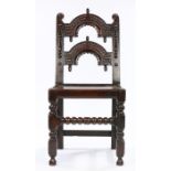 Charles II Oak Derbyshire chair, circa 1660 – 1680. The twin arcaded back panel carved with