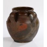 Late 19th Century French pottery oil pot, with two handles to the back and a bulbous body, 18.5cm