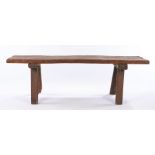 19th Century rustic "pig table", the long thick rectangular top above rectangular section legs,