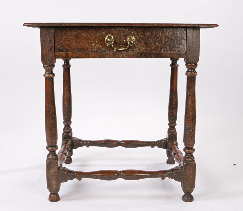 Late 17th Century oak side table, the rectangular top above a frieze drawer and turned supports
