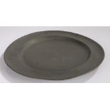 Large 18th Century pewter charger, the circular dish with a London touch mark to the underside, 46cm