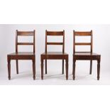 Set of three George III oak side chairs, with bar backs above solid seats and turned legs, (3)