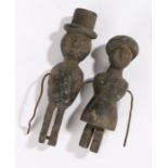 Pair of 19th Century Folk Art figures, of a lady wearing a dress and with a cap, a gentleman in a