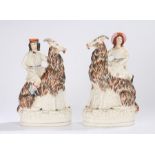 Pair of 19th Century Staffordshire flatback pottery figures, of a lady and gentleman riding goats,