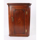 George III oak and inlaid hanging corner cabinet, the dentil moulded cornice above a shell inlaid