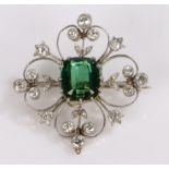 Tourmaline and diamond set brooch, the central 4.10 carat tourmaline with a diamond surround on